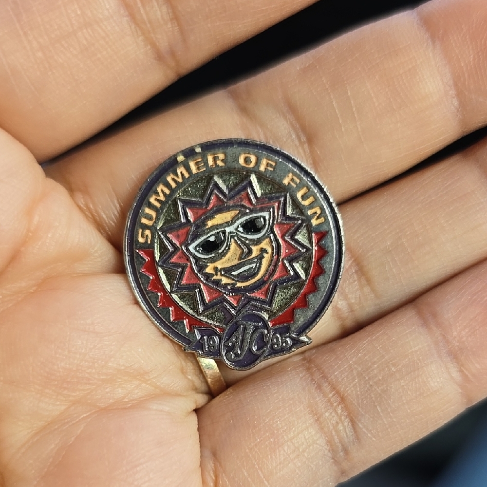 Red and Black Jewelry Pin with Intricate Design